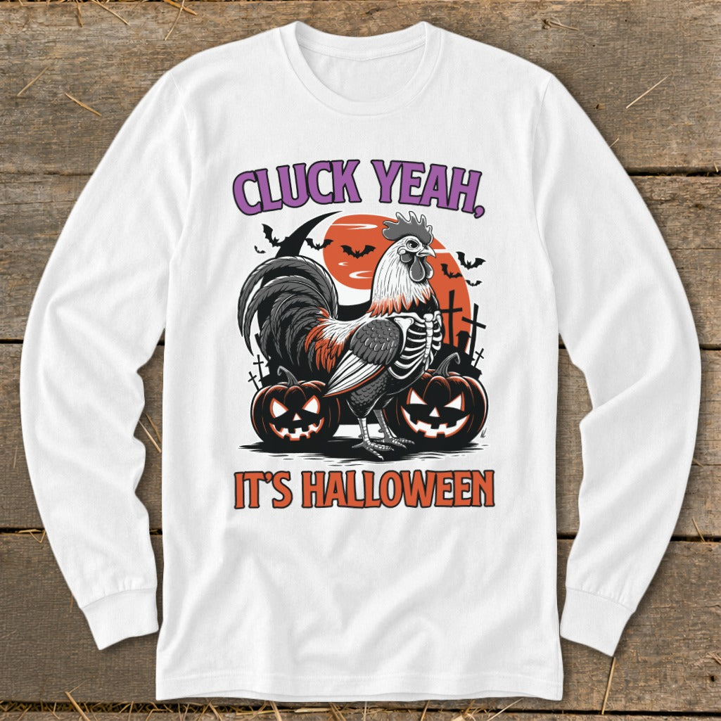 White long-sleeve shirt with skeleton rooster, pumpkins, and text "CLUCK YEAH, IT'S HALLOWEEN".