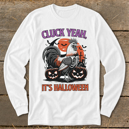 White long-sleeve shirt with skeleton rooster, pumpkins, and text "CLUCK YEAH, IT'S HALLOWEEN".