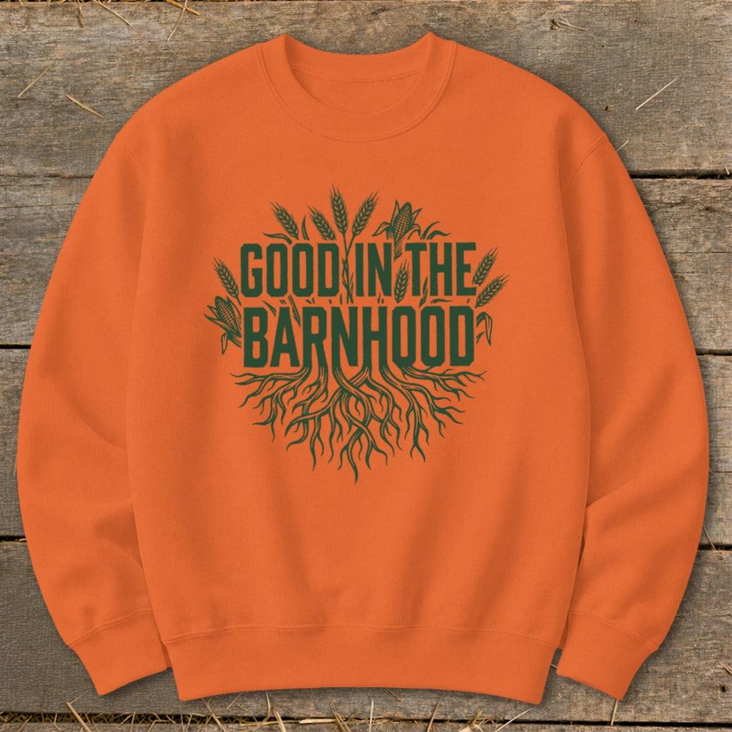 Orange sweatshirt with green text "Good in the Barnhood" and agricultural graphics.