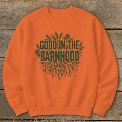 Orange sweatshirt with green text "Good in the Barnhood" and agricultural graphics.