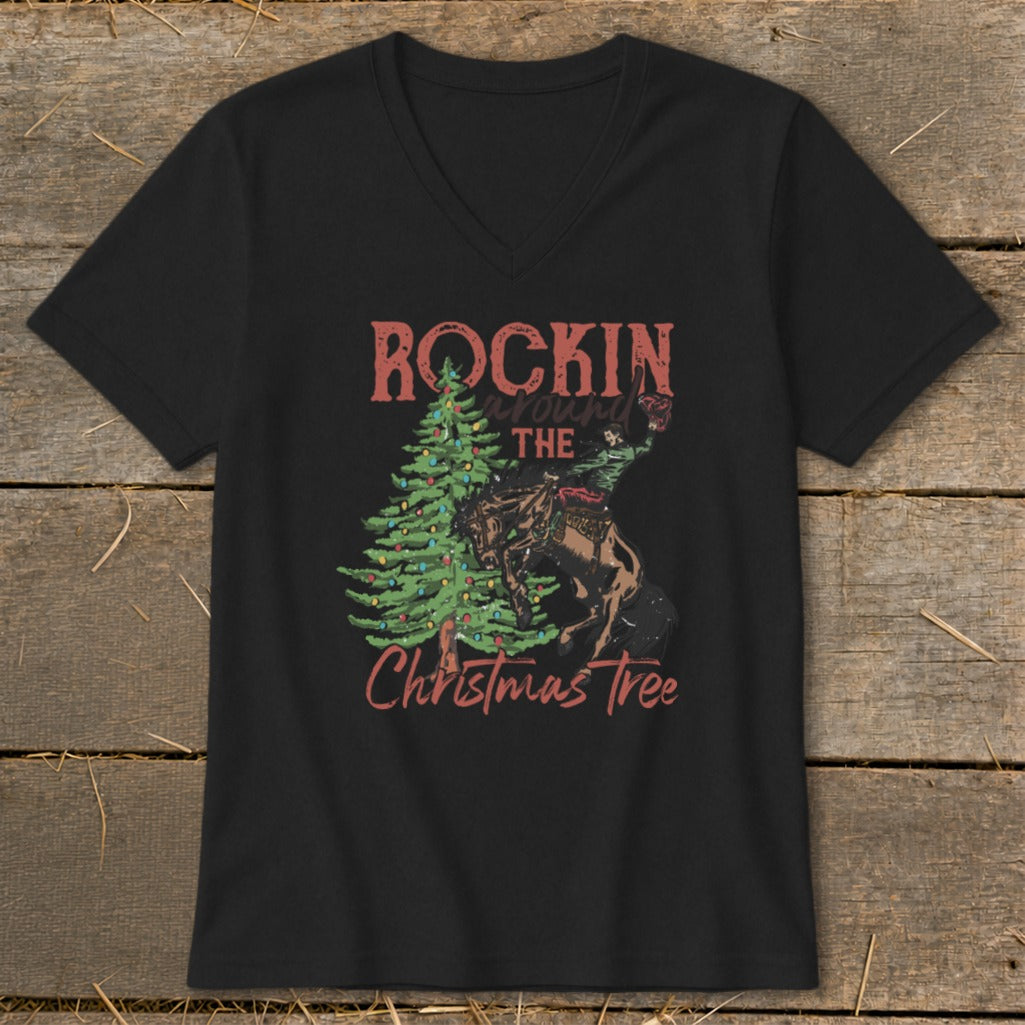 Black t-shirt with "Rockin around the Christmas Tree" graphic featuring a cowboy and tree.