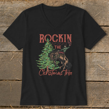 Black t-shirt with "Rockin around the Christmas Tree" graphic featuring a cowboy and tree.