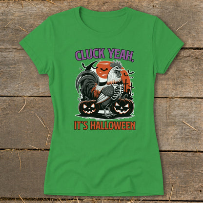 Green t-shirt with skeleton rooster, pumpkins, moon, and text "CLUCK YEAH, IT'S HALLOWEEN".