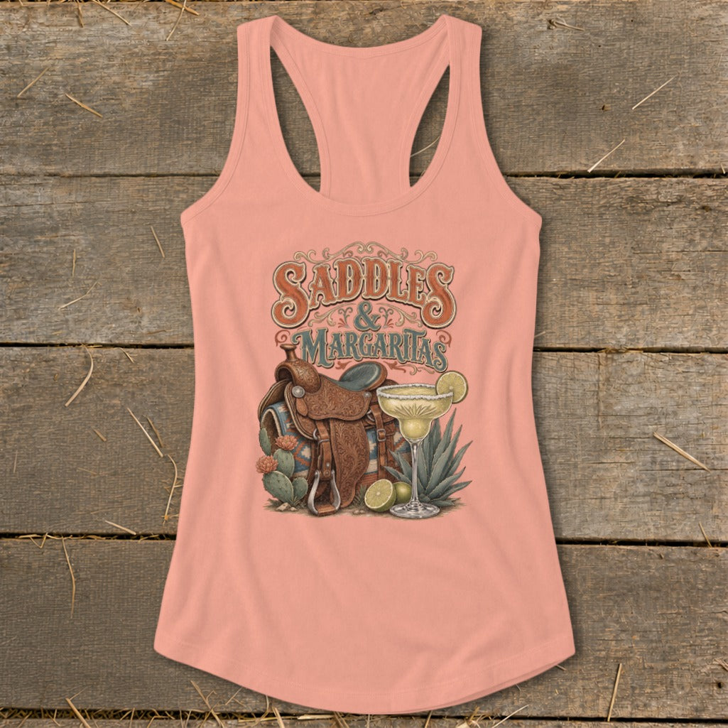 Peach tank top with "Saddles & Margaritas" graphic featuring saddle, margarita, and cacti.