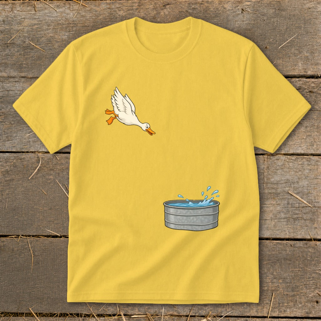 Yellow t-shirt with graphic of a white duck flying towards a galvanized water tub.