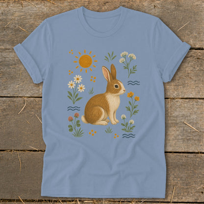 Blue t-shirt with a rabbit and wildflowers design.