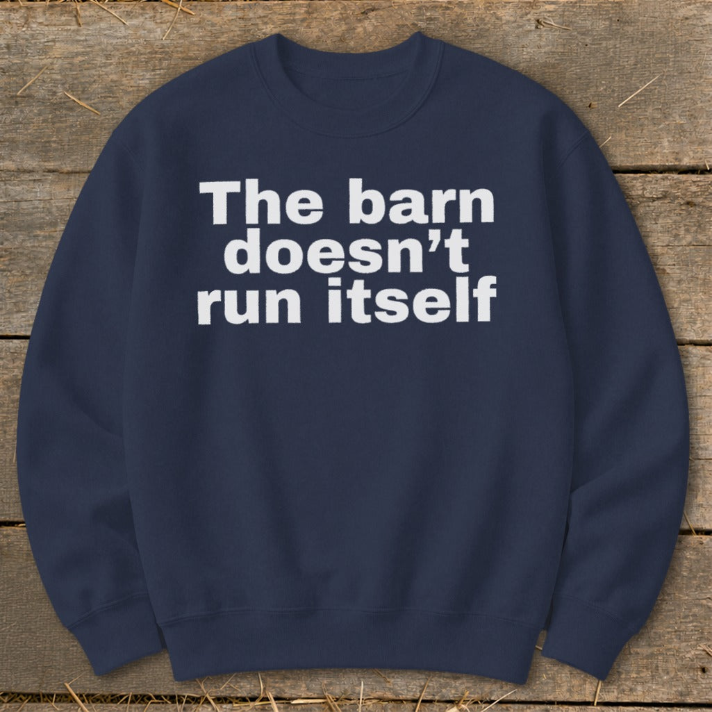Navy sweatshirt with white text reading "The barn doesn't run itself".