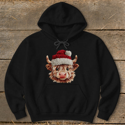 Black hoodie with a Highland cow wearing a Santa hat graphic.