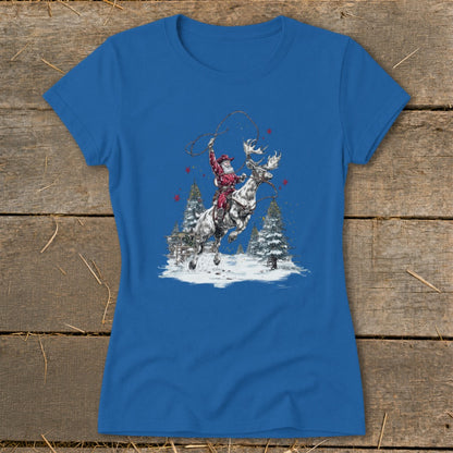 Santa lassoing while riding a reindeer in a snowy landscape with Christmas trees.