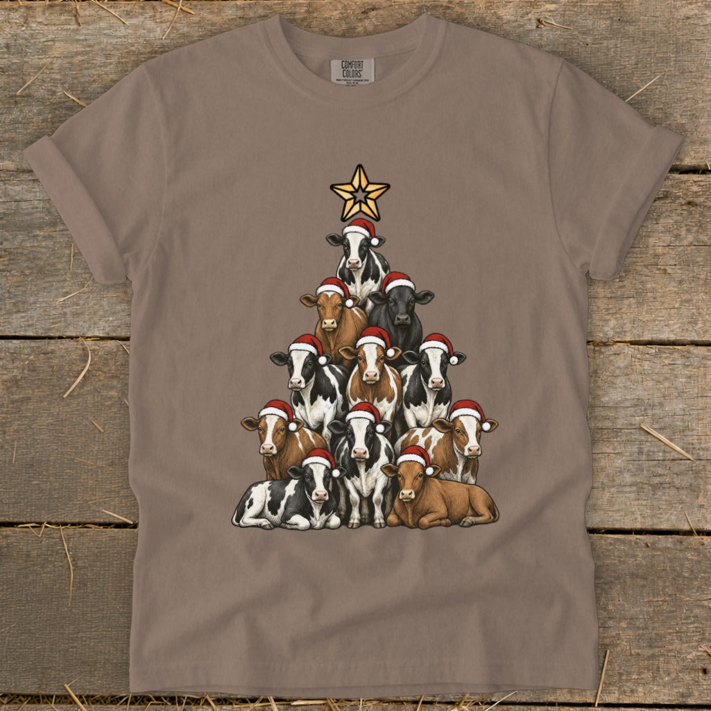T-shirt with a pyramid of cows wearing Santa hats and a star on top.