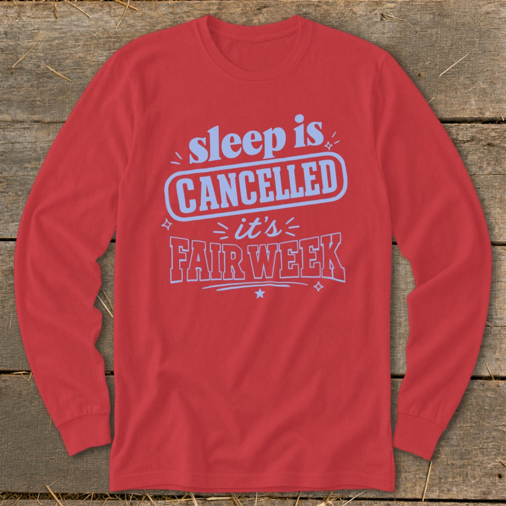 Red long sleeve shirt with "sleep is CANCELLED it's FAIR WEEK" text.