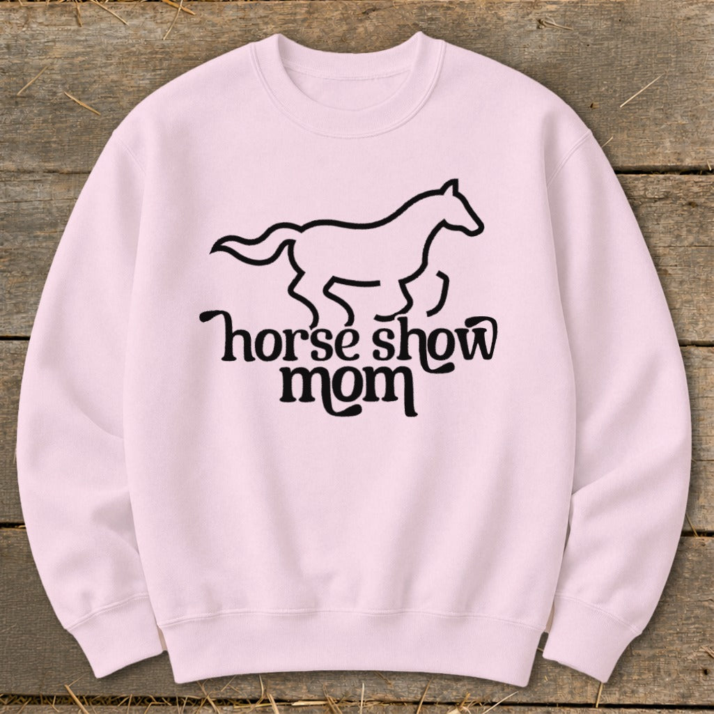 Pink crewneck sweatshirt with a black outline of a horse and "horse show mom" text.