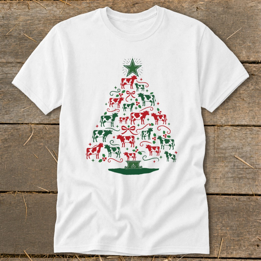 White t-shirt with a Christmas tree design made of red and green cows and ornaments.