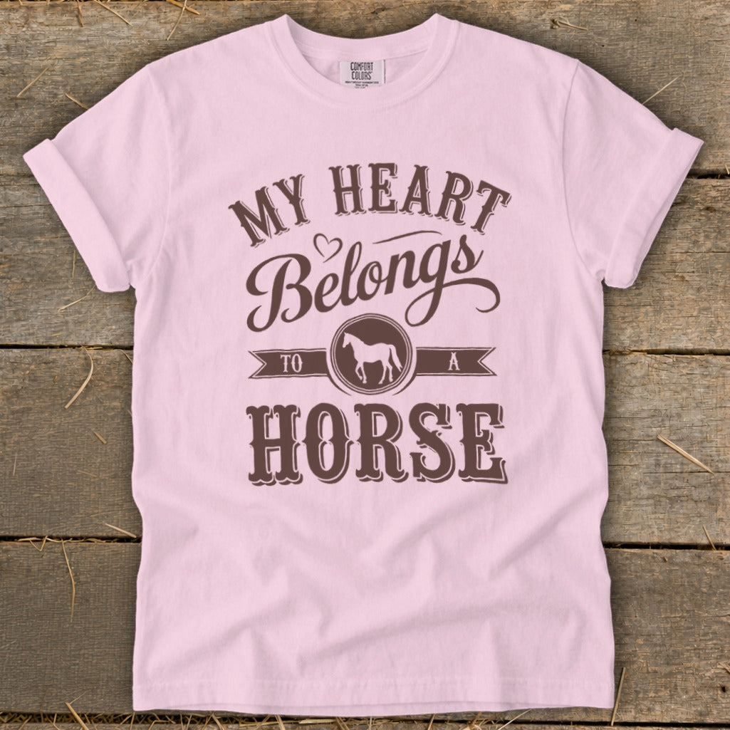 Pink t-shirt with "My Heart Belongs To A Horse" text and horse graphic.