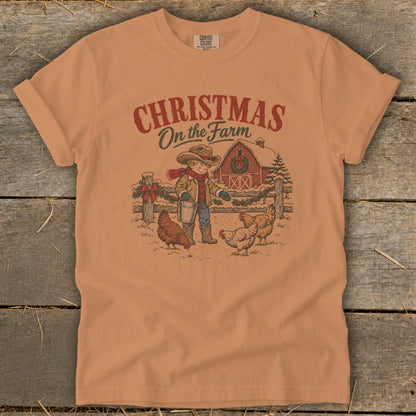 Shirt graphic: Christmas On the Farm with boy feeding chickens near barn.