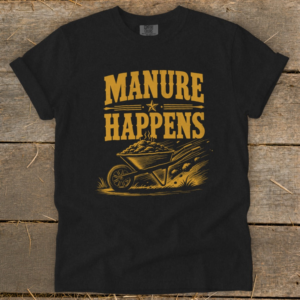 Black t-shirt with "Manure Happens" text and a wheelbarrow graphic.