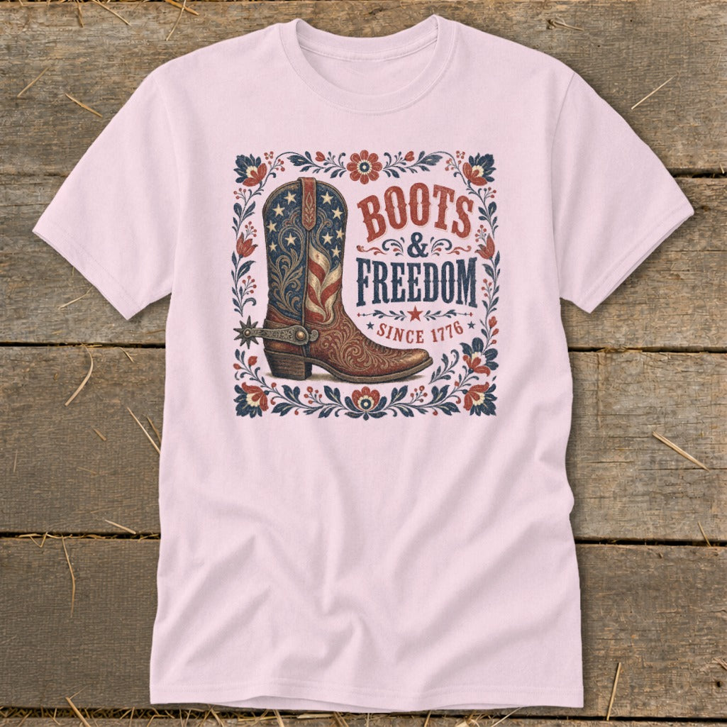 Pink t-shirt with cowboy boot graphic: "Boots & Freedom Since 1776".