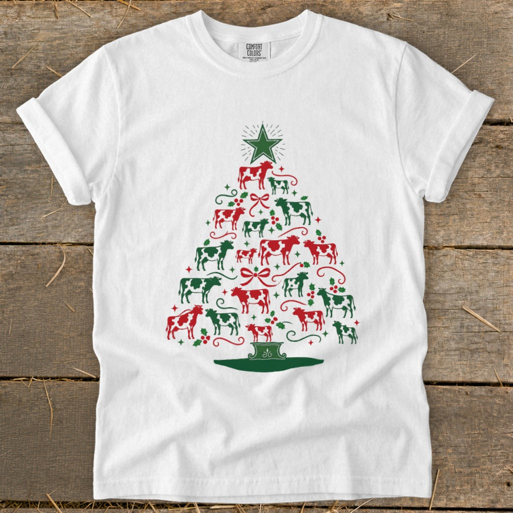 White t-shirt with a Christmas tree made of red and green cows.