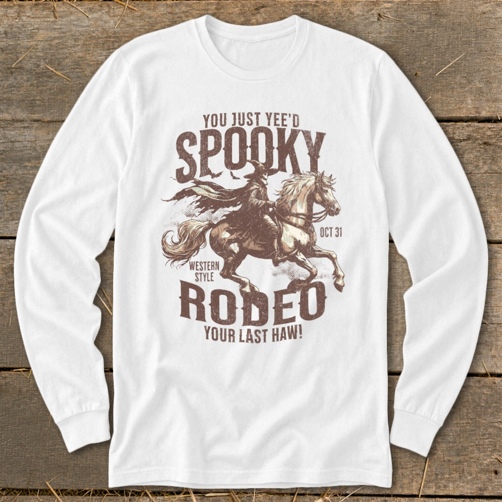 White long-sleeve shirt with "Spooky Rodeo Your Last Haw!" Halloween graphic.
