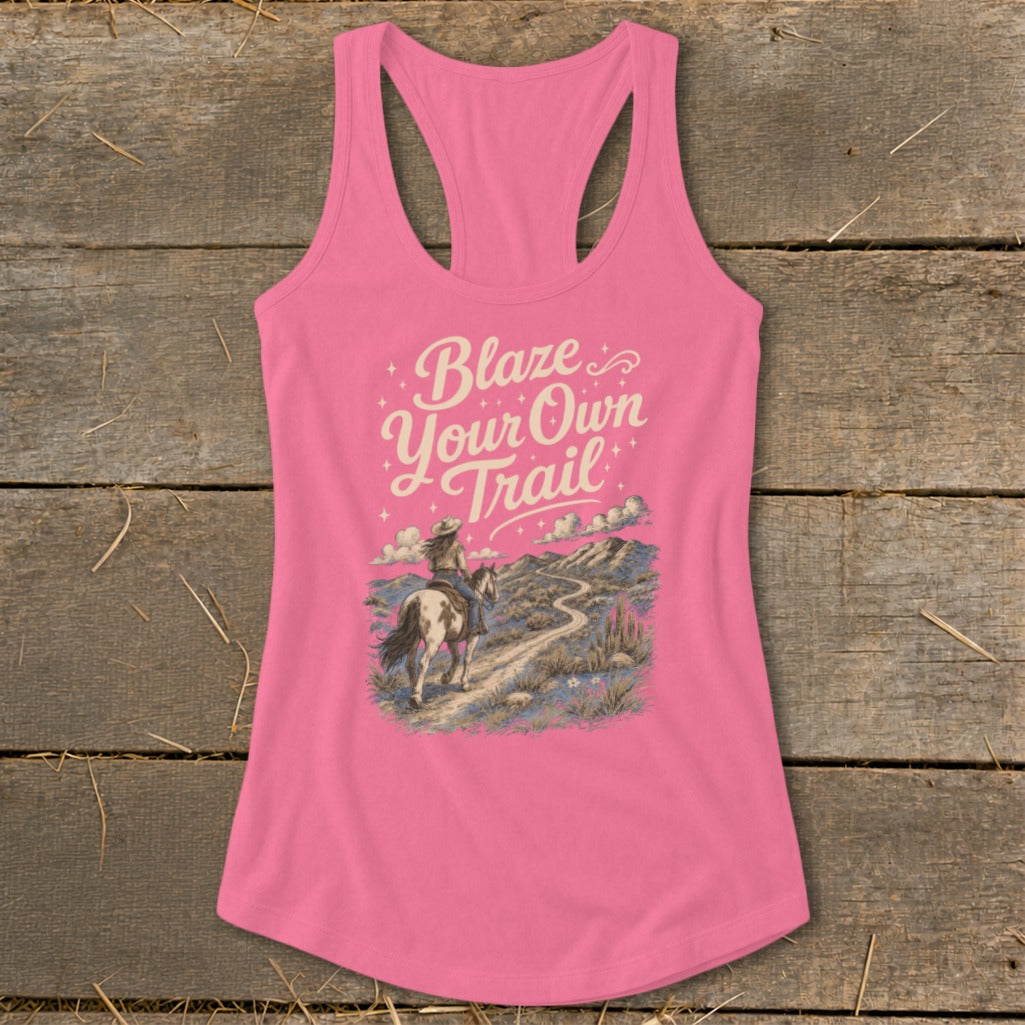Pink tank top with "Blaze Your Own Trail" text and a woman on horseback.