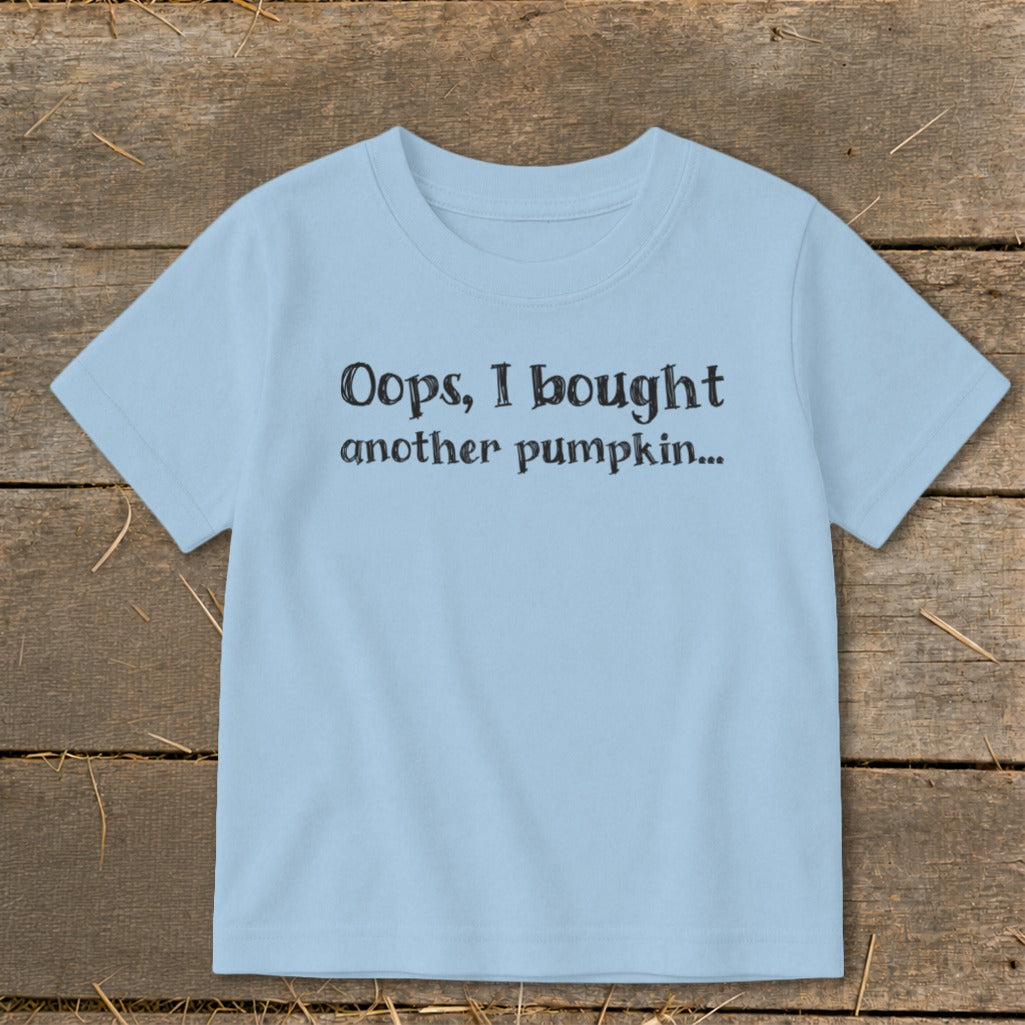 Light blue t-shirt with "Oops, I bought another pumpkin..." text.