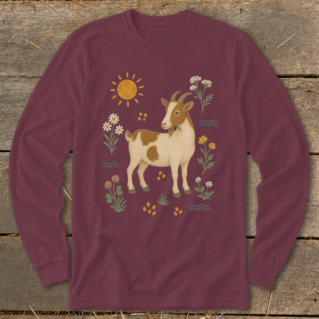 Maroon long-sleeve shirt with a brown and white goat surrounded by flowers and a sun.