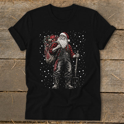 Santa in overalls carries a sack of gifts and holds a pitchfork amid falling snow.