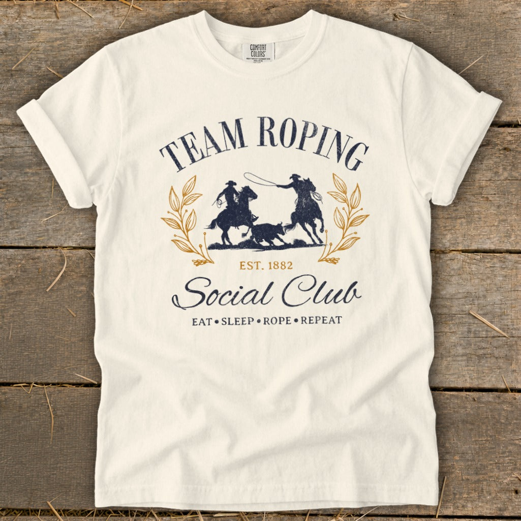 Team Roping Social Club t-shirt with cowboys, calf, and laurel wreath design.
