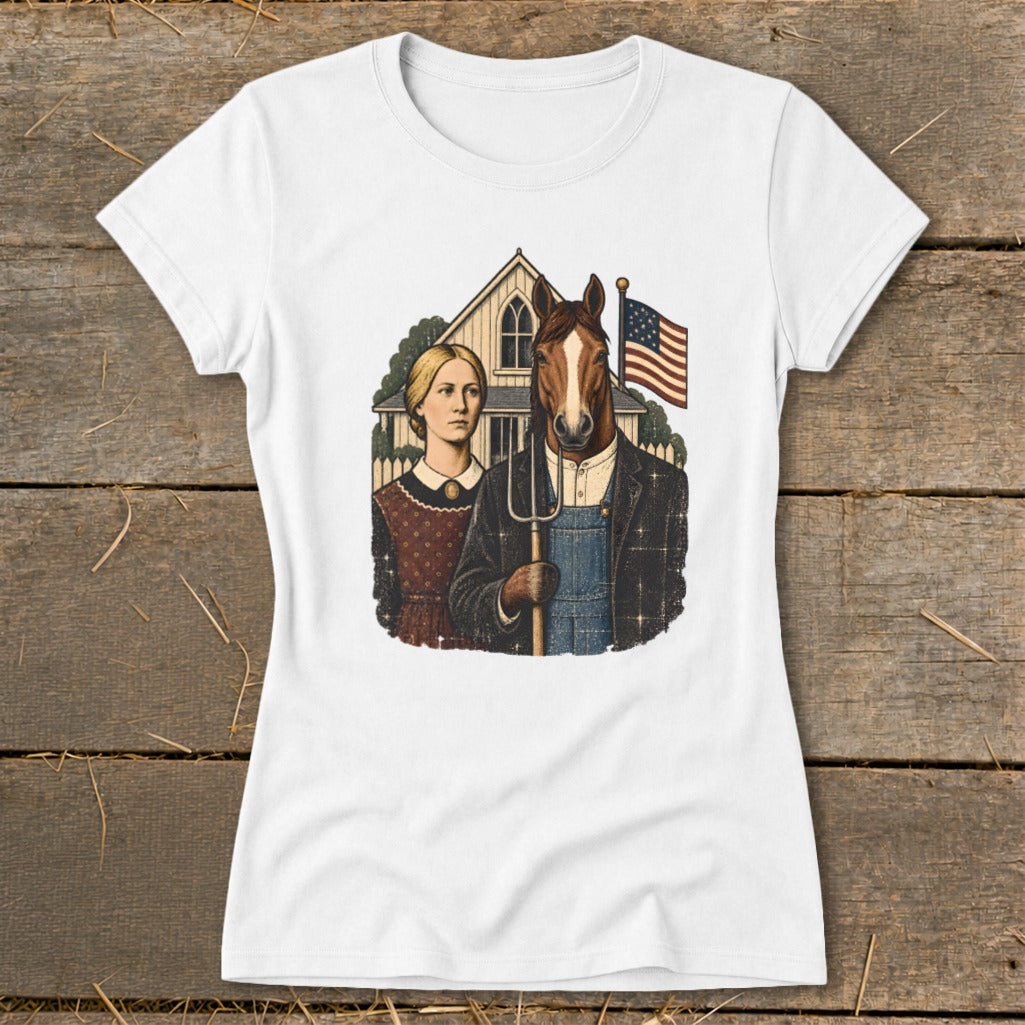 A white t-shirt featuring a parody American Gothic graphic with a woman and a horse holding a pitchfork.