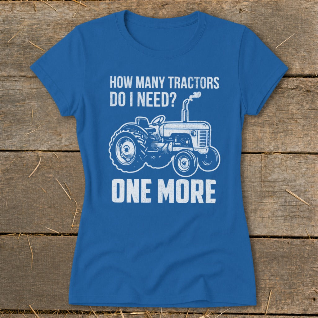 Blue t-shirt with white text and tractor graphic: "How Many Tractors Do I Need? One More."