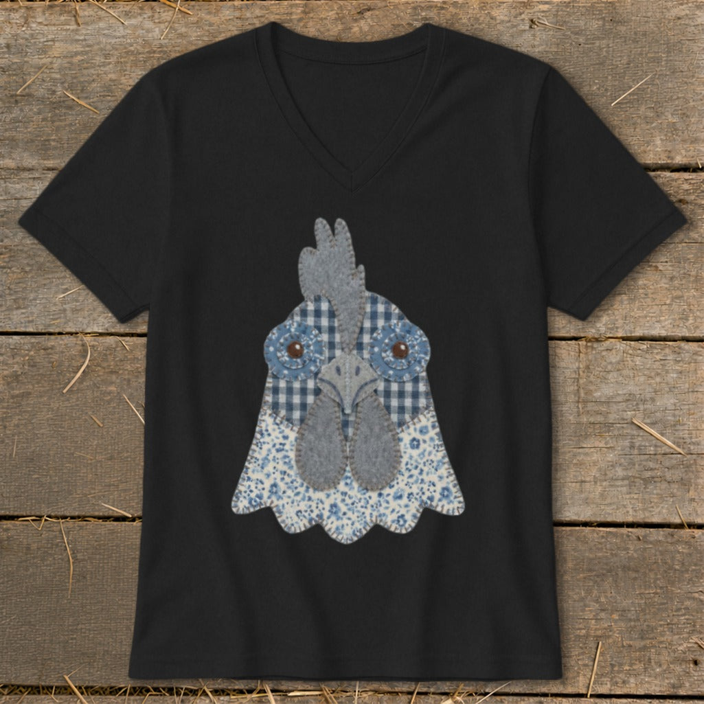 Black v-neck t-shirt with a folk art fabric chicken face graphic.
