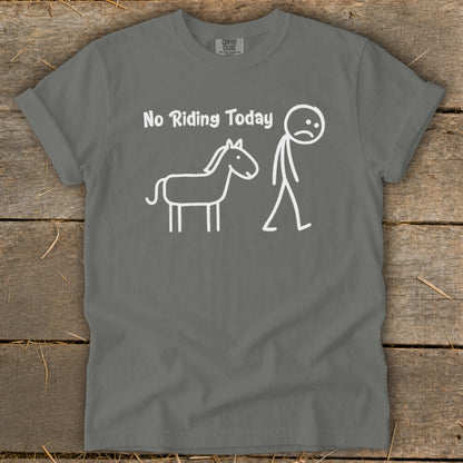 Gray t-shirt with white text "No Riding Today" and stick figures of a sad person and horse.