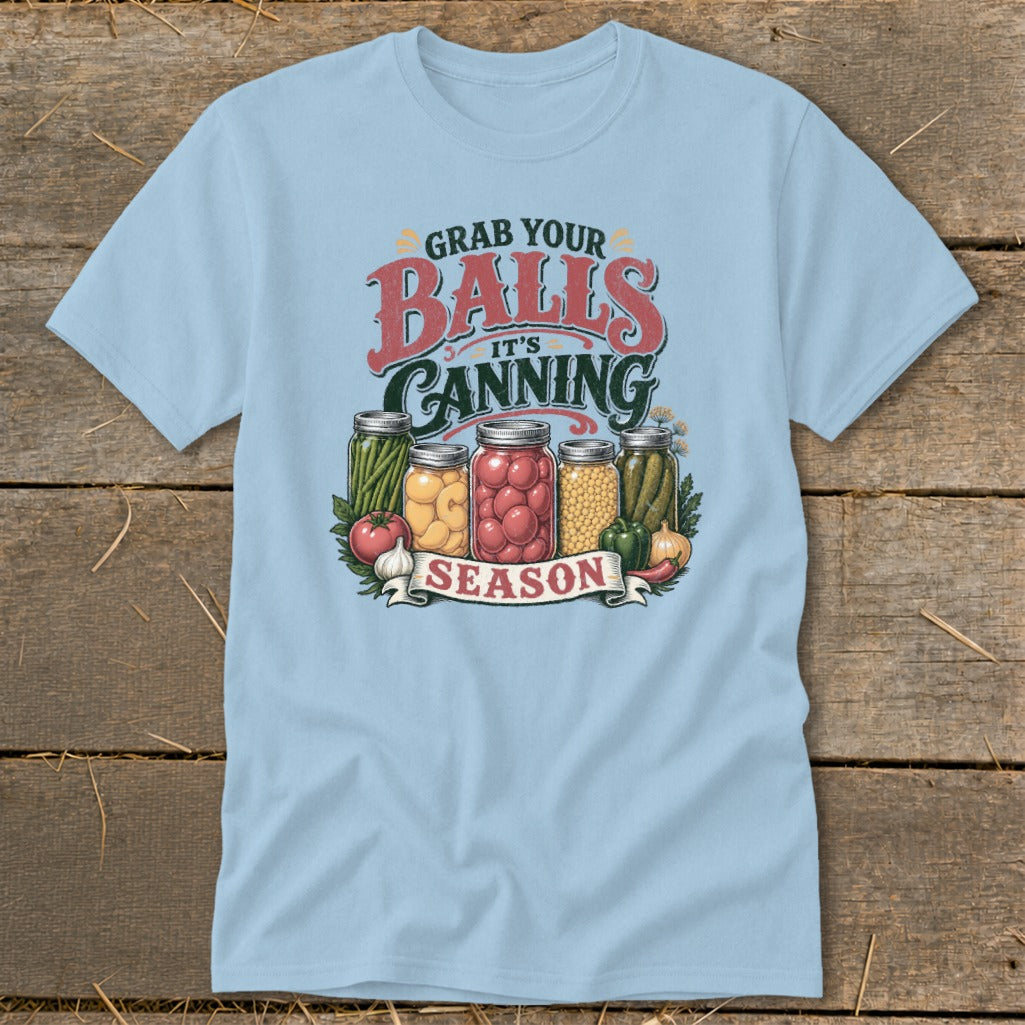Light blue t-shirt with "Grab Your Balls It's Canning Season" graphic and canned goods.