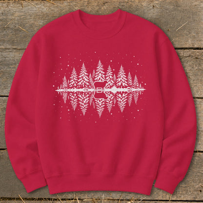 Red sweatshirt with a white graphic of pine trees, a sheep, and a guitar reflected in water.