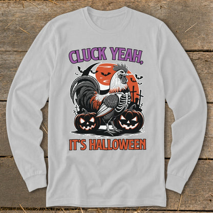 Rooster skeleton with pumpkins and bats, "CLUCK YEAH, IT'S HALLOWEEN" text.