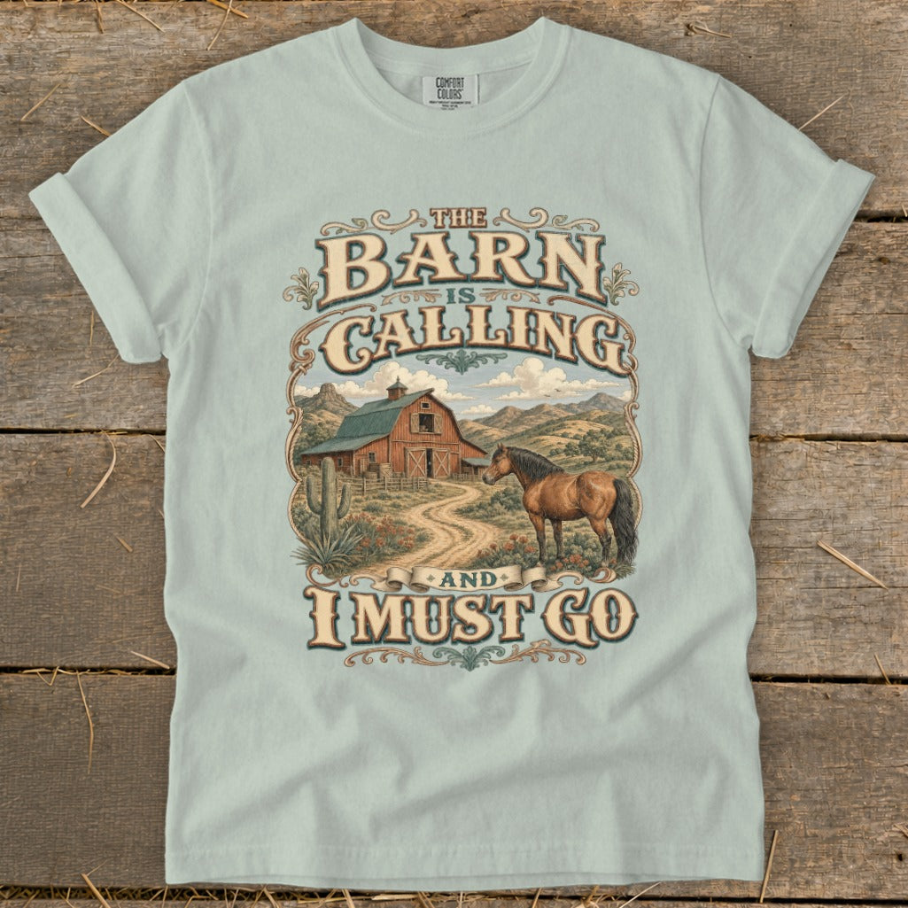 Light blue t-shirt with "The Barn is Calling and I Must Go" text and graphic.