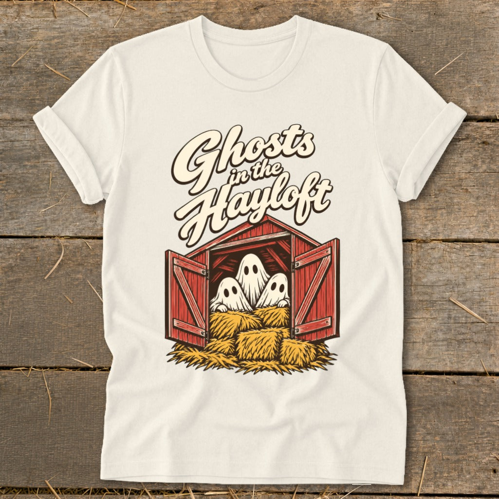Ghosts in the Hayloft graphic on a cream t-shirt with three ghosts in a barn.