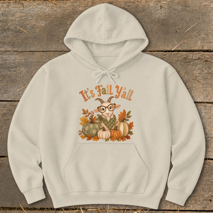 Light beige hoodie with a goat wearing glasses surrounded by pumpkins and fall leaves.
