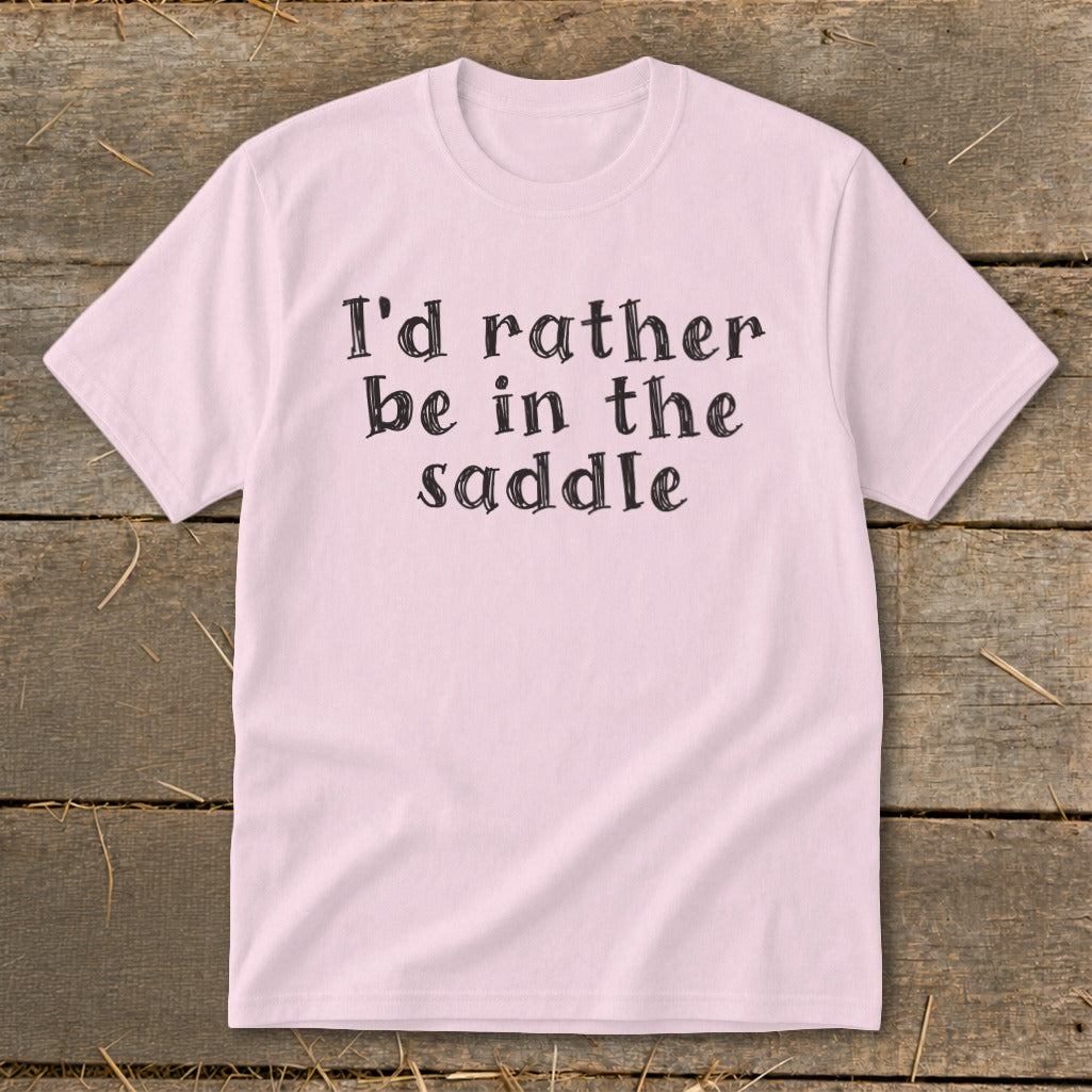 Pink t-shirt with black text "I'd rather be in the saddle."