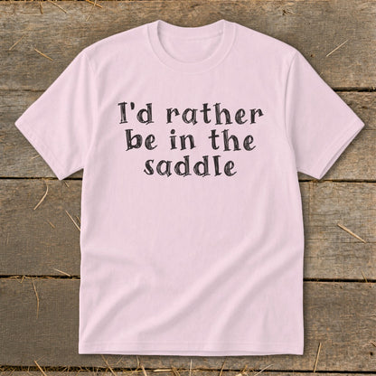 Pink t-shirt with black text "I'd rather be in the saddle."