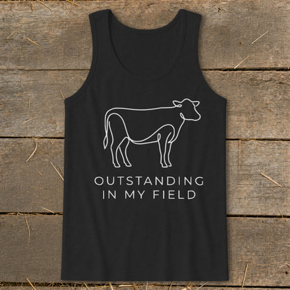 Black tank top with white line art cow and text "OUTSTANDING IN MY FIELD".