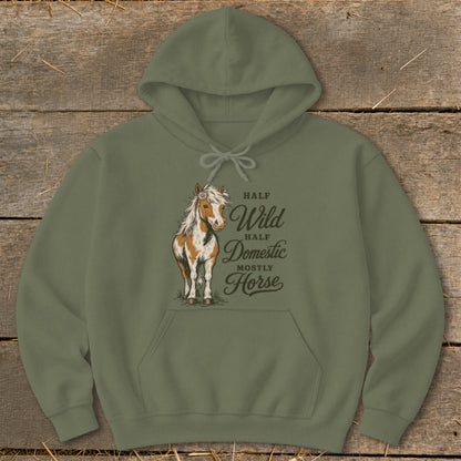 Olive hoodie with a graphic of a pinto horse and the text "Half Wild, Half Domestic, Mostly Horse."