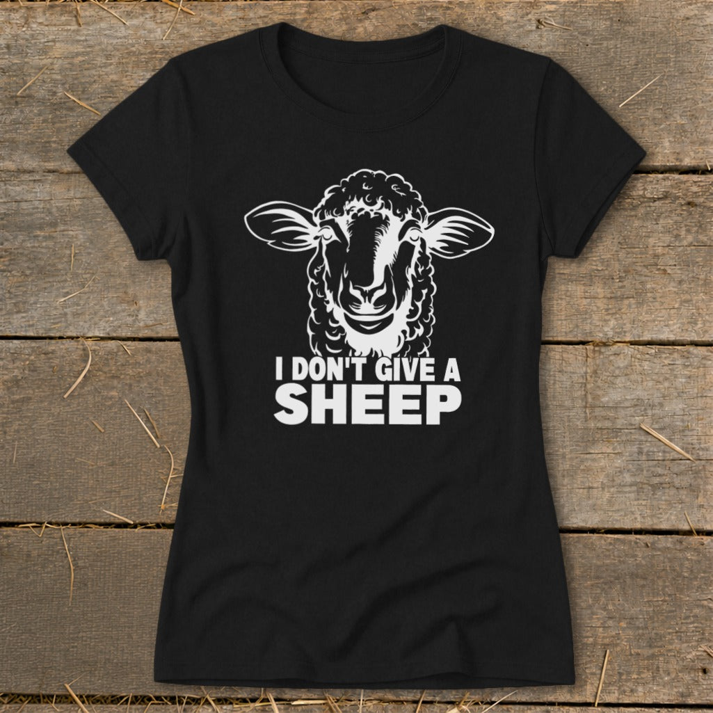 Black t-shirt with white graphic of a sheep's head and text "I DON'T GIVE A SHEEP".