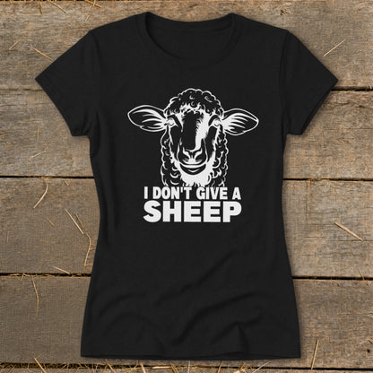 Black t-shirt with white graphic of a sheep's head and text "I DON'T GIVE A SHEEP".