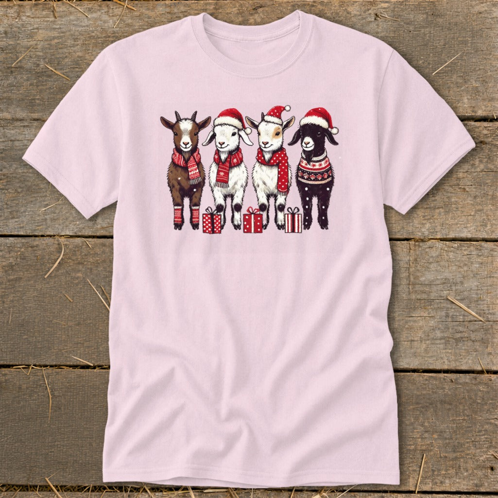 Four goats in Santa hats and festive scarves stand in a line with gifts.