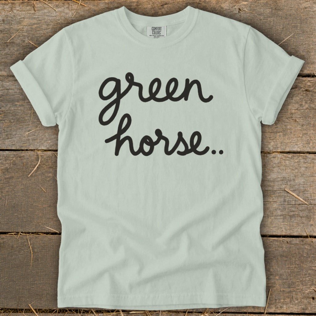 Light green t-shirt with black cursive text "green horse.."