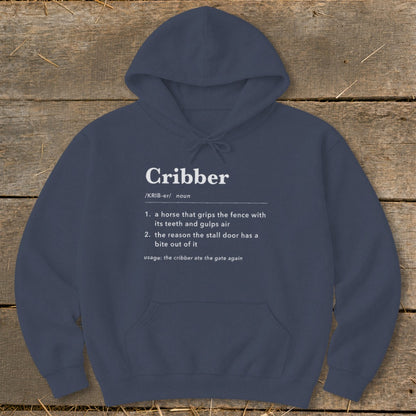 Navy blue hooded sweatshirt featuring white dictionary-style text defining the word "Cribber" for horses.