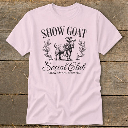 Pink t-shirt with "SHOW GOAT Social Club" text and a goat illustration.
