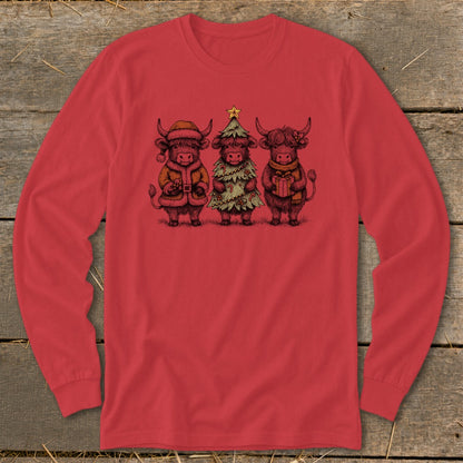 Three Highland cows in festive Christmas attire, one as Santa, one as a tree, one with a gift.
