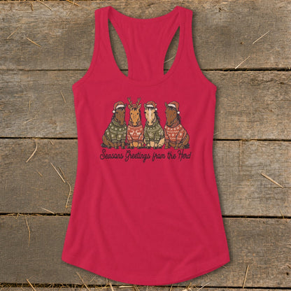 Four horses wearing Santa hats and sweaters, with text "Seasons Greetings from the Herd".
